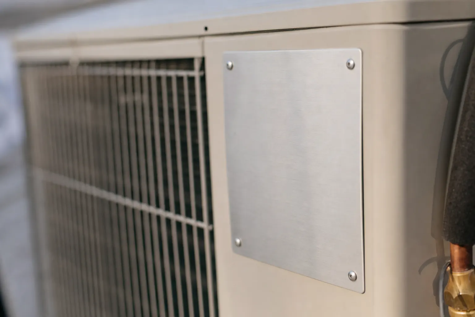 Close-up of the specification plate area on a new air conditioning unit